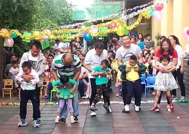 玉泉区幼儿园邀请小朋友的爸爸参加"快乐父亲节"亲子活动,让孩子亲近