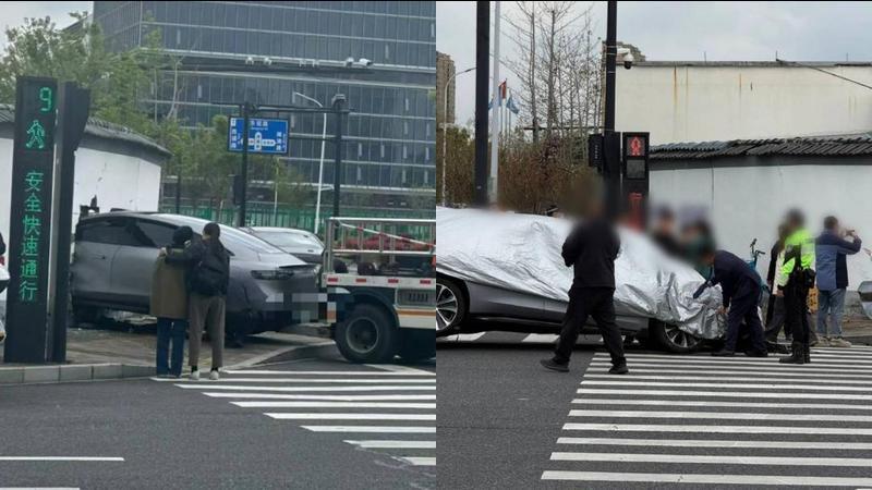 杭州一新能源车撞入围墙，刚脱困就被盖上车衣？多方回应